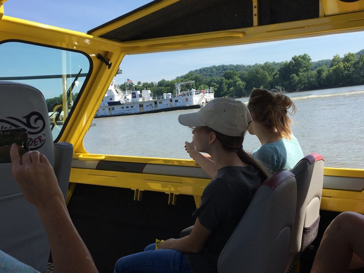 a group of people sitting on a boat