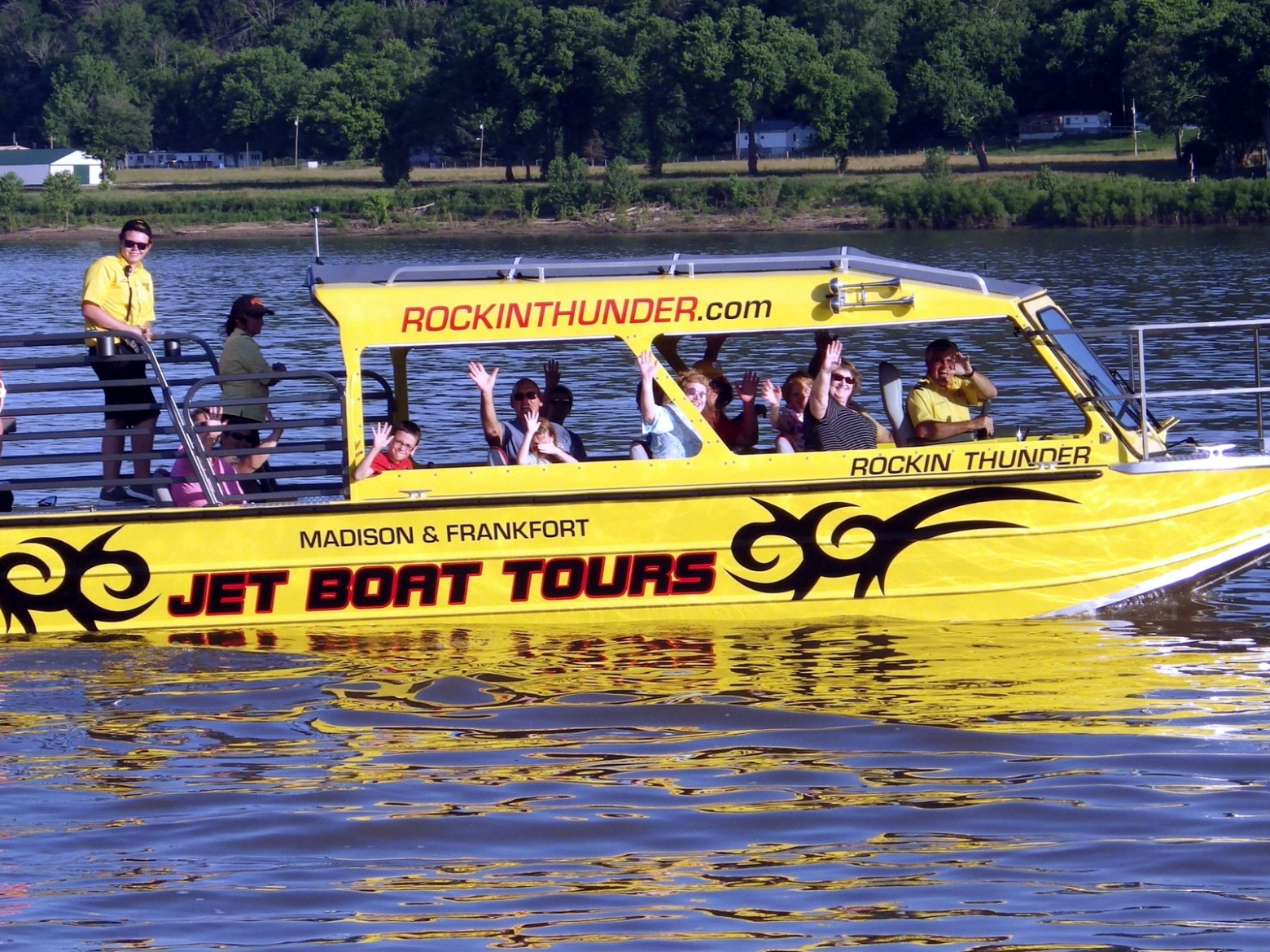 a group of people on a boat in the water